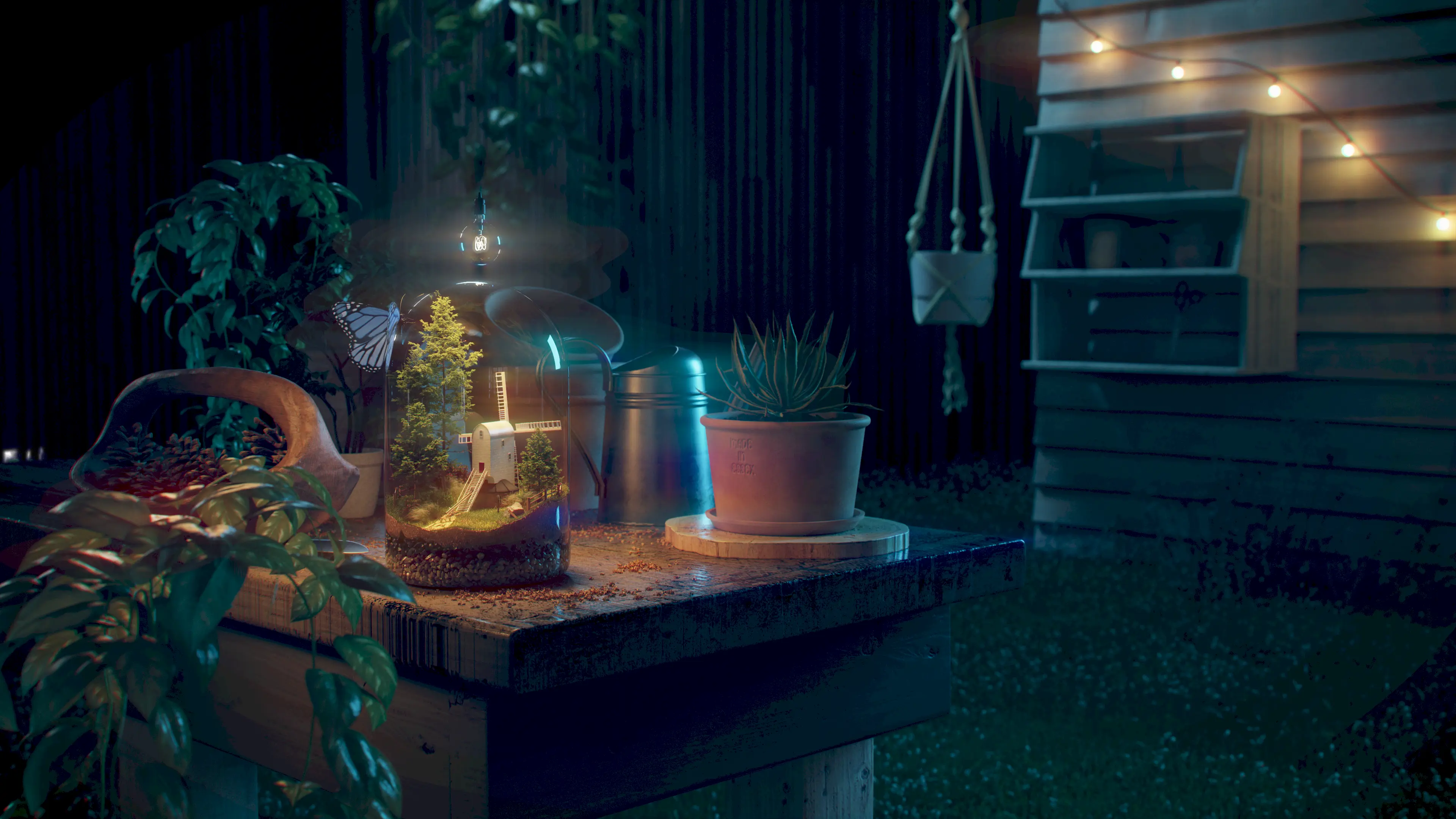 Wide view of workbench in a garden with a terarrium on it.